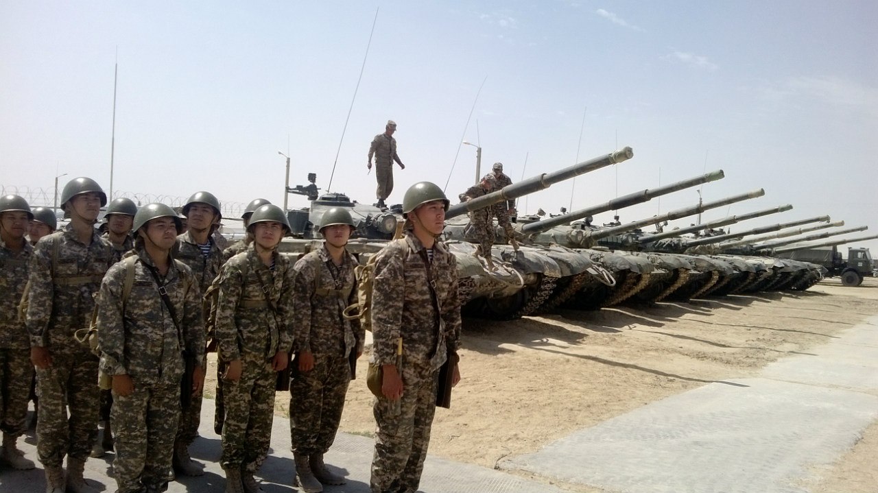 Cadets by armoured vehicles at the training ground
